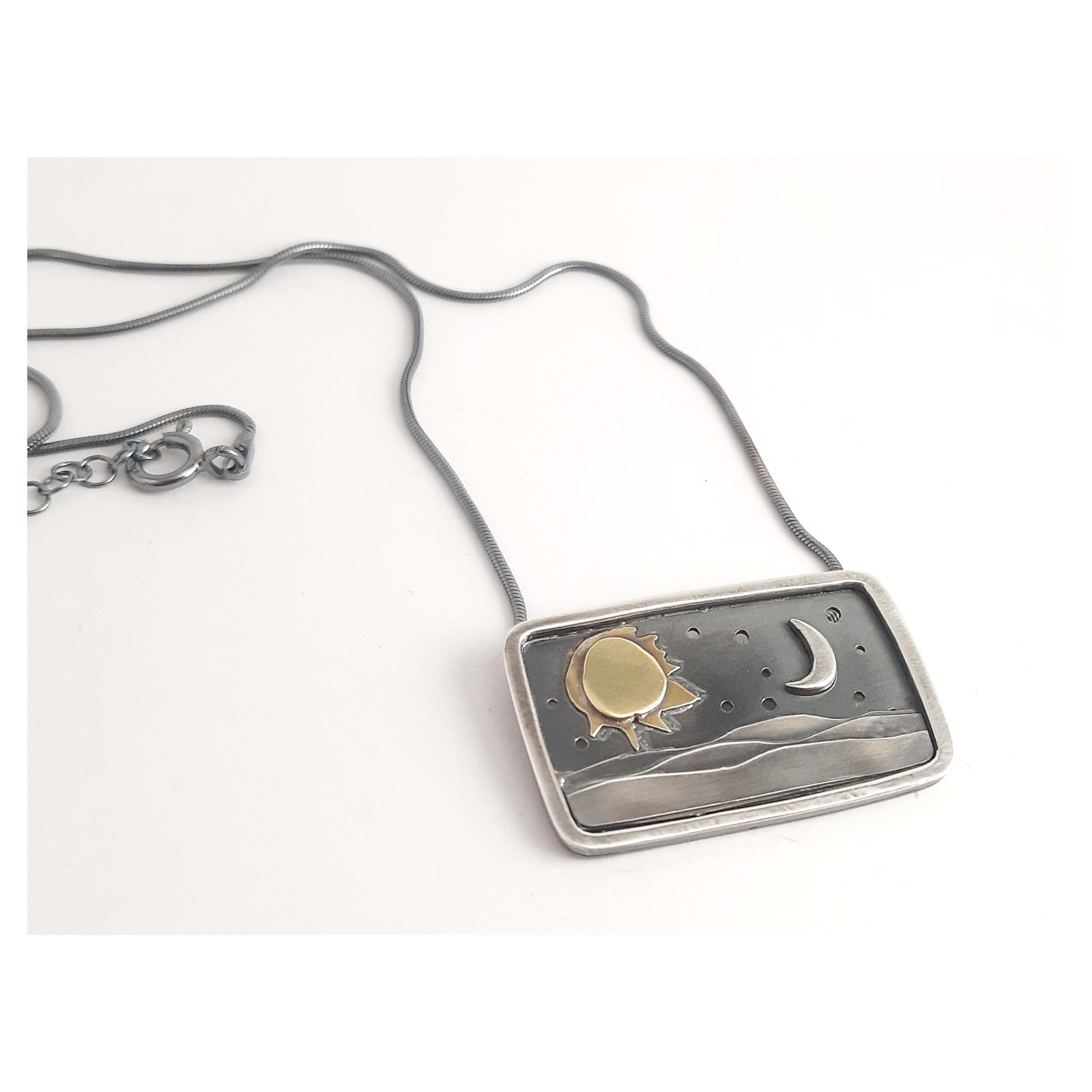 Penjoll de plata i bronze personalitzat
